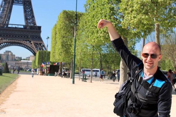 Check: he's holding the Eiffel Tower! 